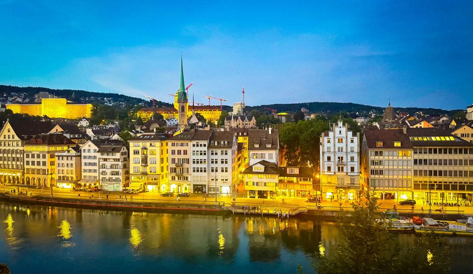 Zurich's old town along the river at dusk
