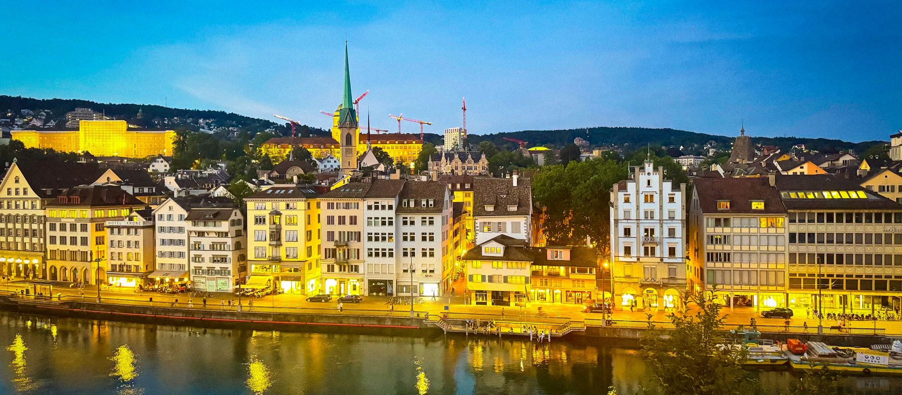 Zurich's old town along the river at dusk